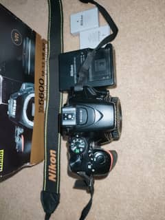 Nikon  D5600 dslr with 18-55 mm lens ,bag ,box, charger and batteries