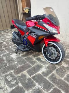 Red and black colour heavy bike with lights