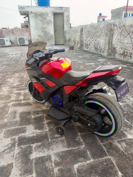 Red and black colour heavy bike with lights 2