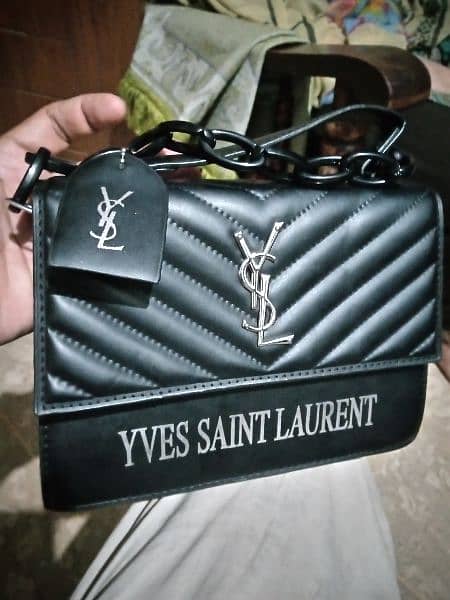 imported yves saint Lourent hand bag. 1