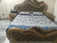 queen size bed with side table