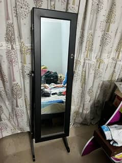 Jewelery storage stand with mirror