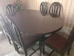 Dinning table with 6 chairs in 10/10 condition for sale.