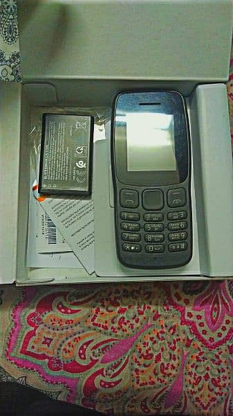 Nokia 106 with box and charger 0