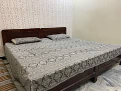 2 single wooden beds with foam