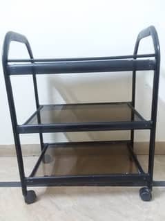 Tinted glass trolley in black colour