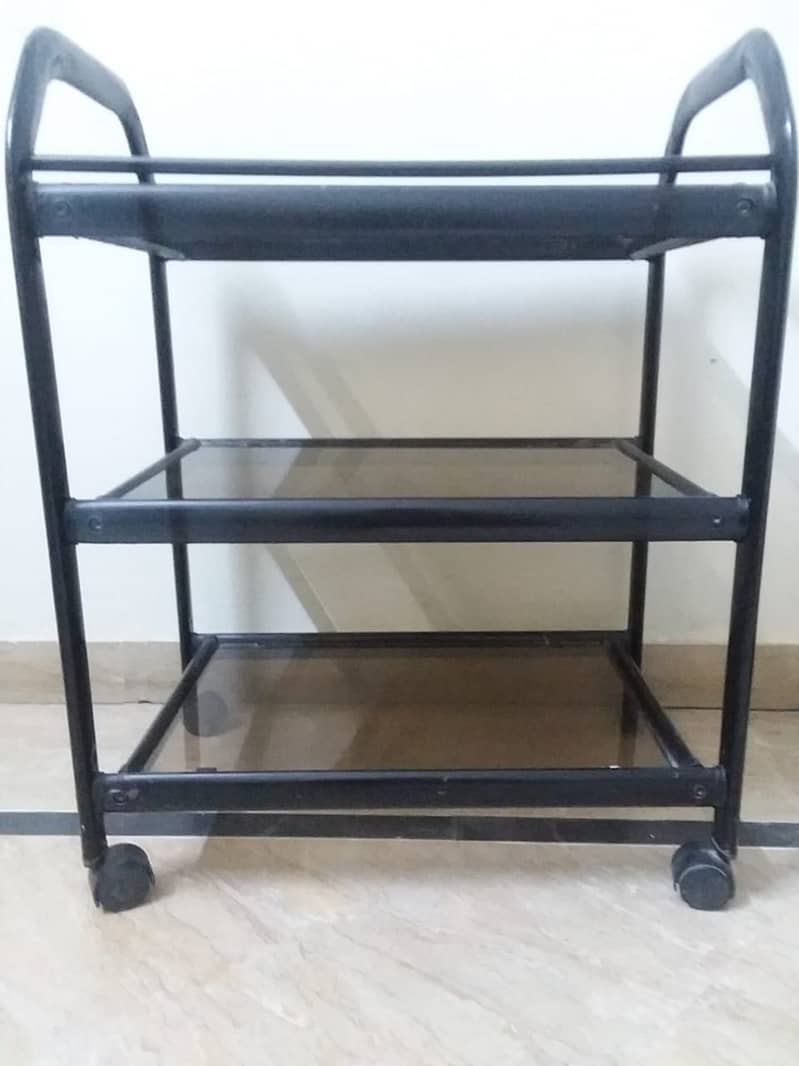 Tinted glass trolley in black colour 1