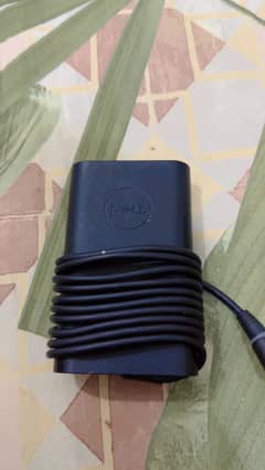 Dell Laptop 65W, 19V Genuine charger in working condition.