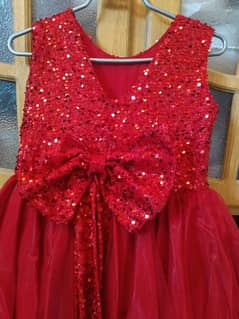 Red fancy frock for girls aged 6-7 years. Perfect party wear.