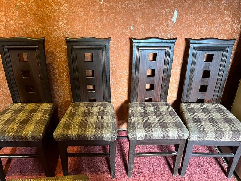 six dark brown wooden cushioned dinning chairs 5