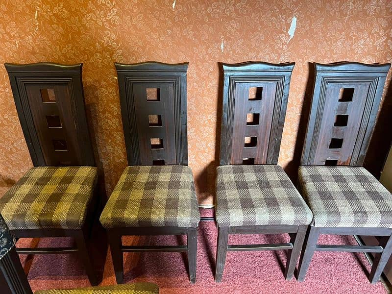 six dark brown wooden cushioned dinning chairs 7