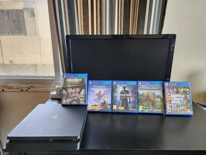 ps4 slim with monitor and 5 games 0