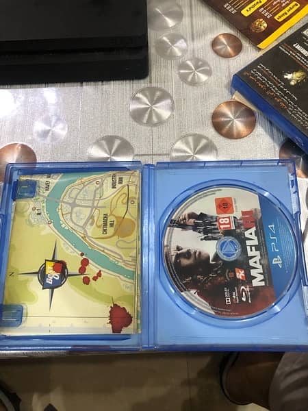 Ps4 slim (500gb) and 2 games 9