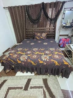 King size rod iron bed with matress and dressing mirror.