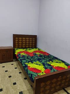 a single bed with moltifom mattress with one side table condition 10/9