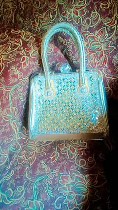 Golden fancy hand bag