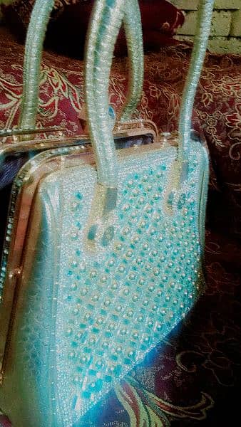 Golden fancy hand bag 1