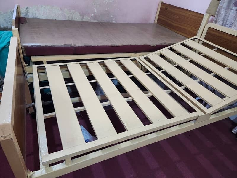 Two movable iron beds. 2