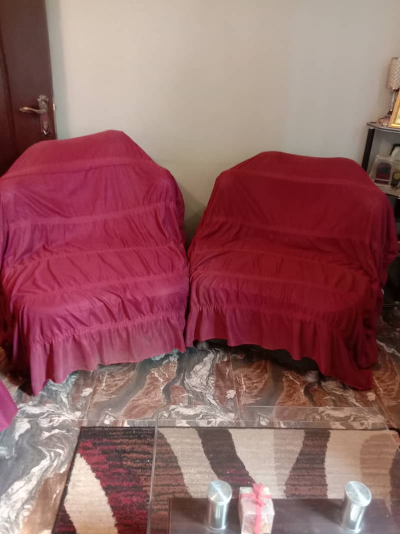 Only 2 years old used 7 seater sofa set with table and sofa covers 2