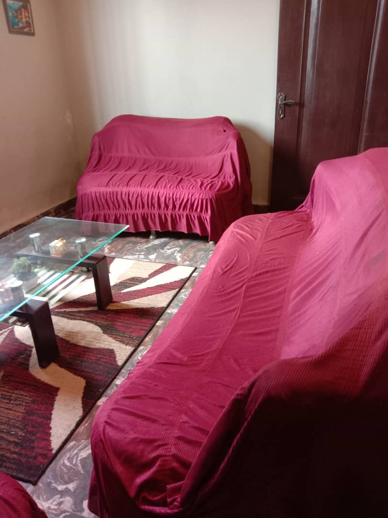 Only 2 years old used 7 seater sofa set with table and sofa covers 5