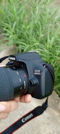 canon 4000d with full box and accessories  75300 lense 0