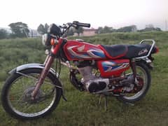 Honda 125 red color all documents are clear contact no  03129845742