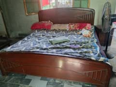 kind bed with mattress with one side tables