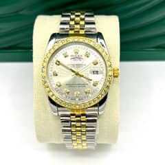 silver and golden colour watch 0