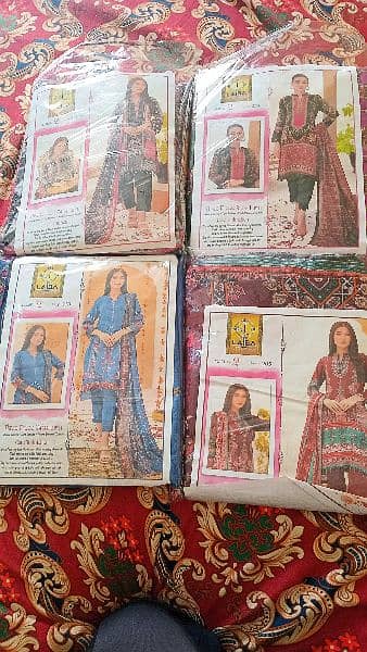 Three Piece Swiss Lawn suits in many Designs for sale. 5