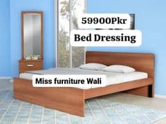 bed with side tables and dressing table