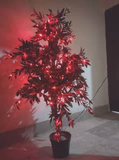 Artificial  tree with wodden stem and lights