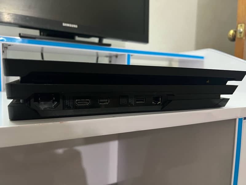 PS4 Pro, 2TB Storage + 4 CDs Free 3