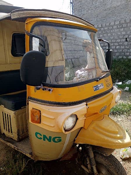 School pickup rickshaw plus loader 1