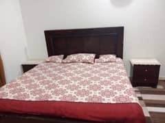 wooden bed  with 2 side  tables and mattress 0