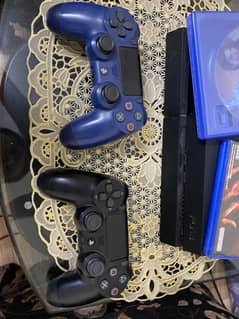 PS4 fat with 2 controllers and two games