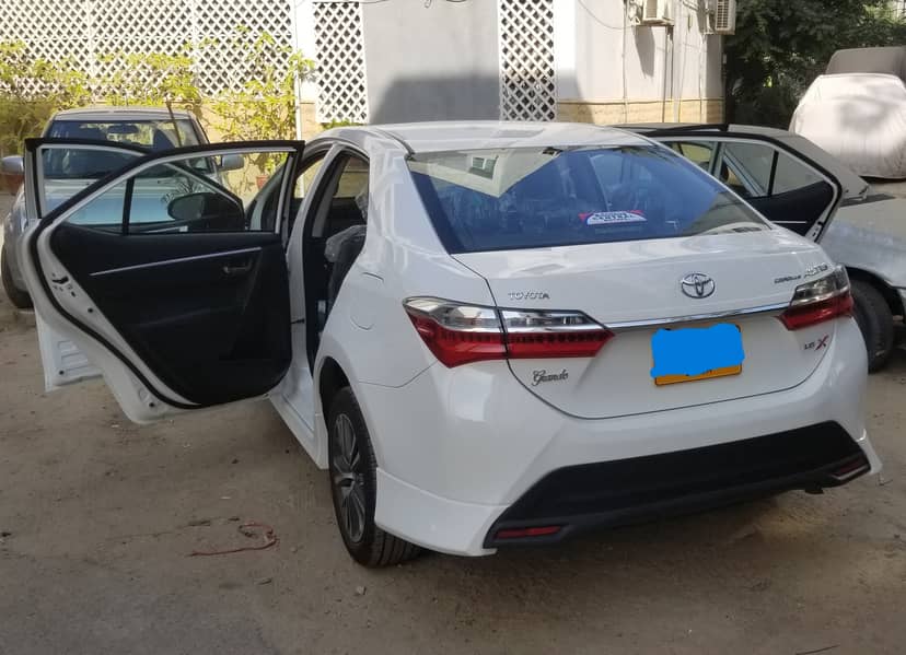 Toyota Altis Grande White 2021 with black interior. Slightly used car. 1