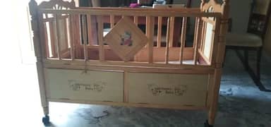 Baby cot, new condition slightly used with mattress and wheels