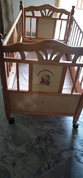 Baby cot, new condition slightly used with mattress and wheels 1