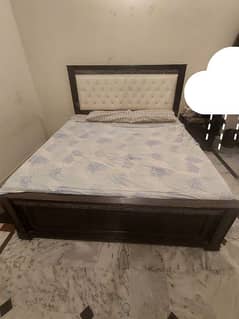 king size bed with side table and dressing