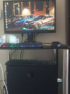 gaming PC with screen and rgb keyboard, mouse and headphones