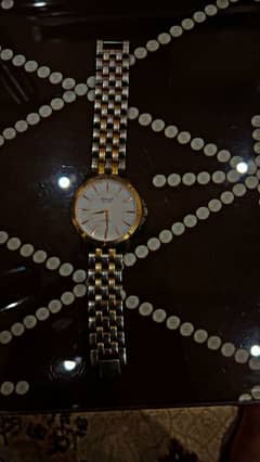 omax original watch with silver and gold color