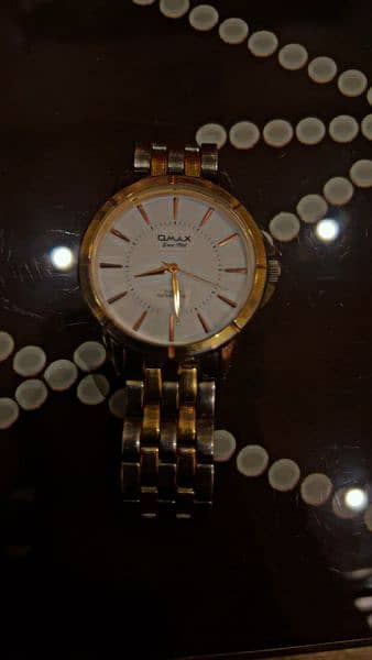 omax original watch with silver and gold color 1