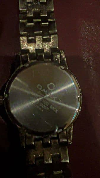 omax original watch with silver and gold color 2