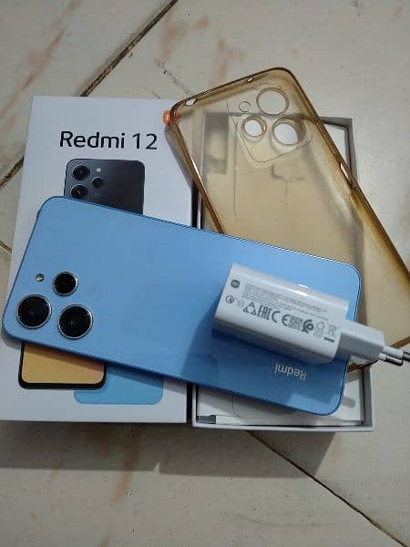 Redmi 12 (8+8/128) with box+Charger. 3