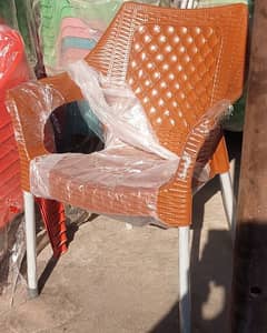 Four plastic chairs with one folding table