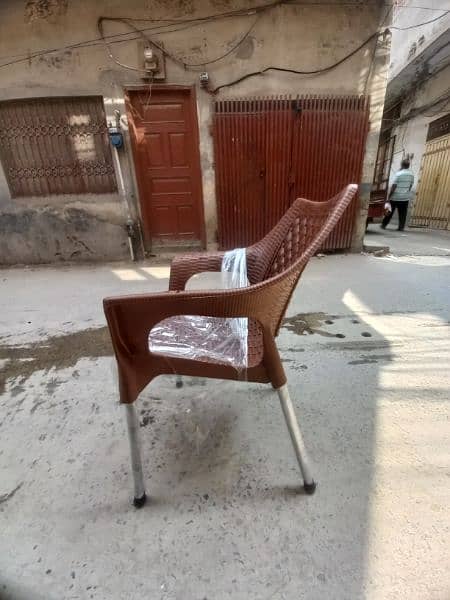 Four plastic chairs with one folding table 2