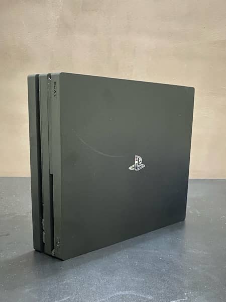 PS4 pro 1tb with original box and 2 controllers 3