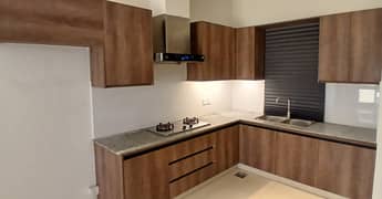 un furnished Residential Luxury Brand New 2 Bed Apartment Available For Sale Near DHA Phase 4 0