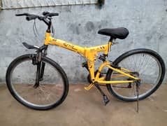 Yellow shine wood foldable bicycle