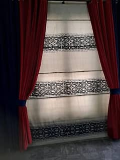 RED AND BLUE CURTAINS AND WHITE BLIND